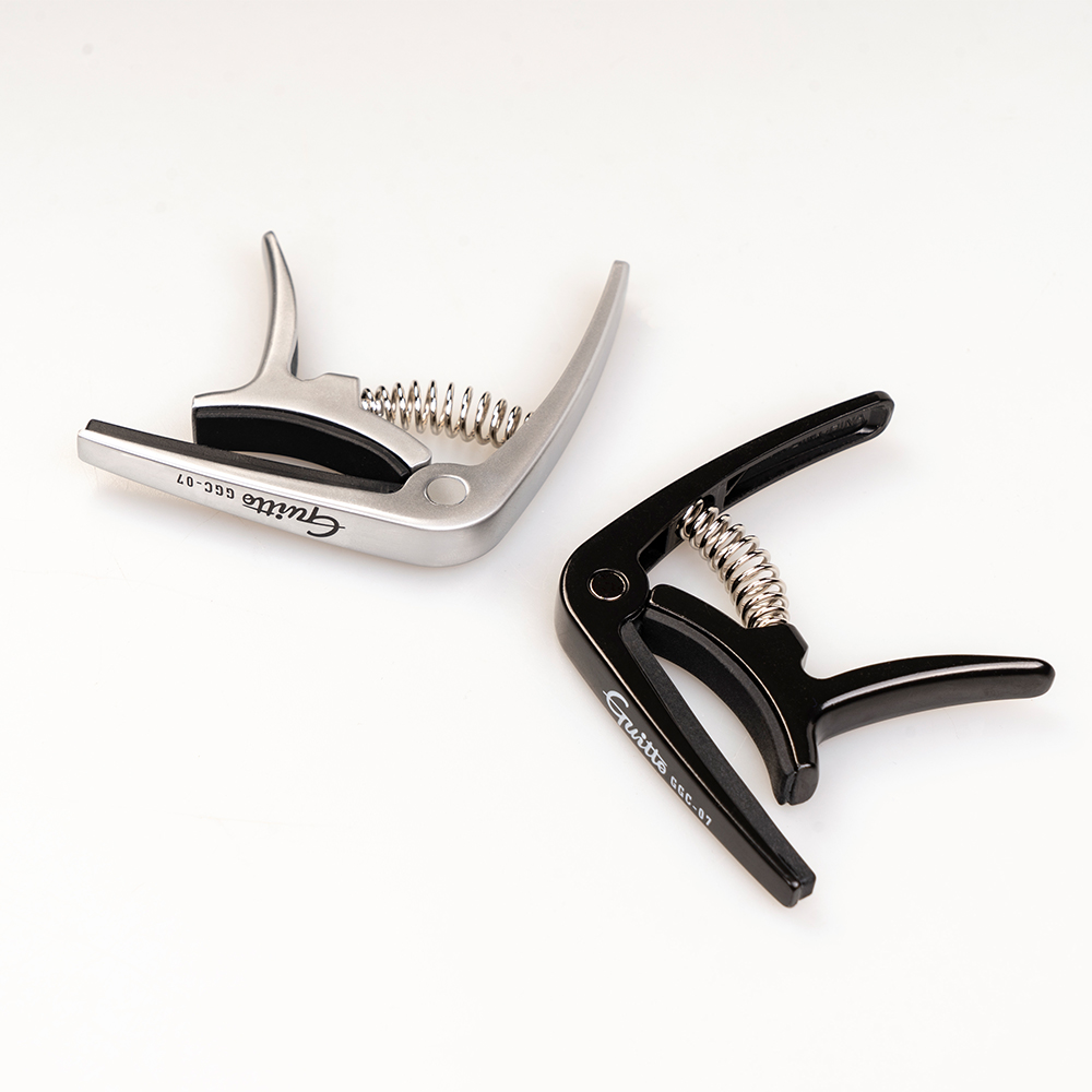 GUITTO GGC-07 Ukulele Capo Qui - Musical Instrument In English recension och pris